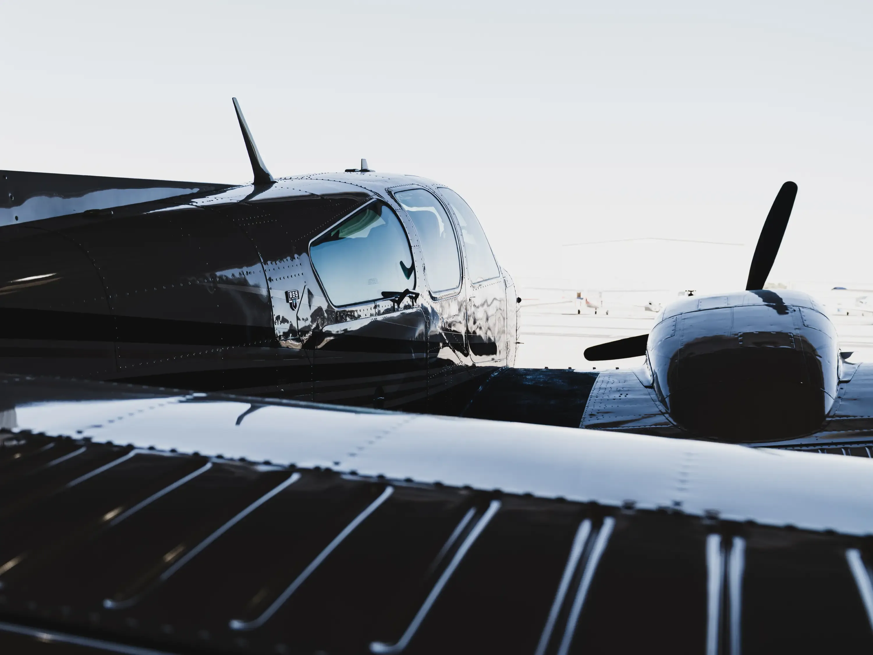 254MJ Beechcraft Baron B55 side front view in the hangar at Fox Field at Lancaster, California