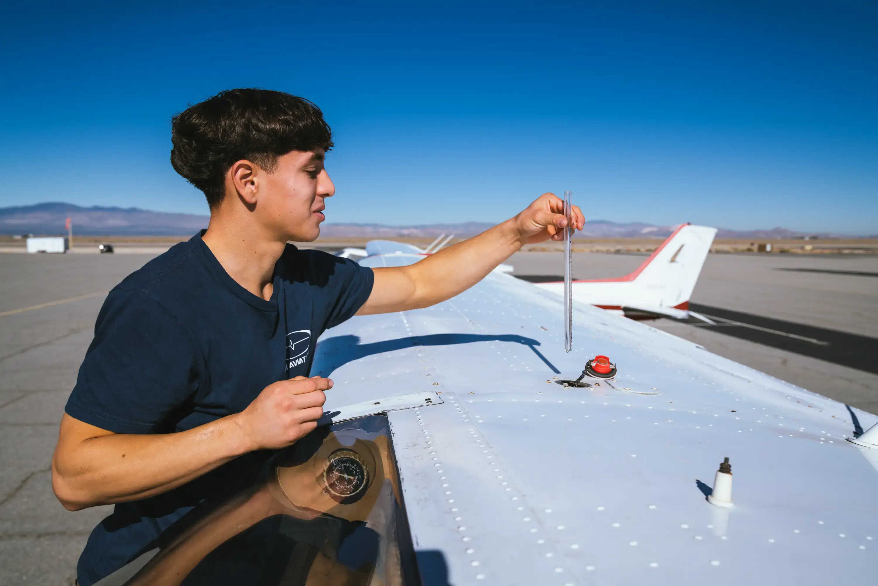 Instructor and student reviewing a checklist at MH Aviation