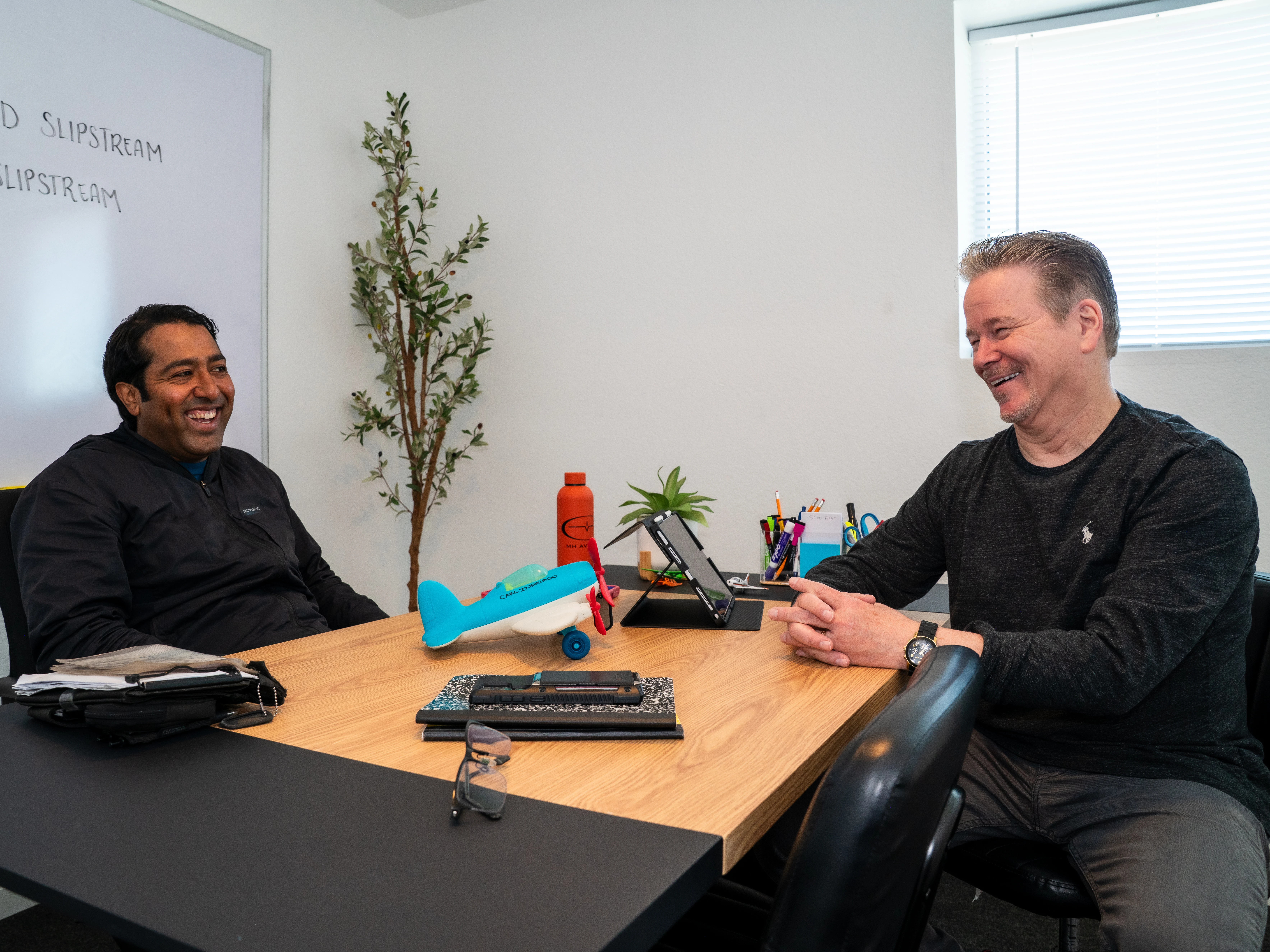 Flight instructor and student pilot during a briefing at MH Aviation at Lancaster, California