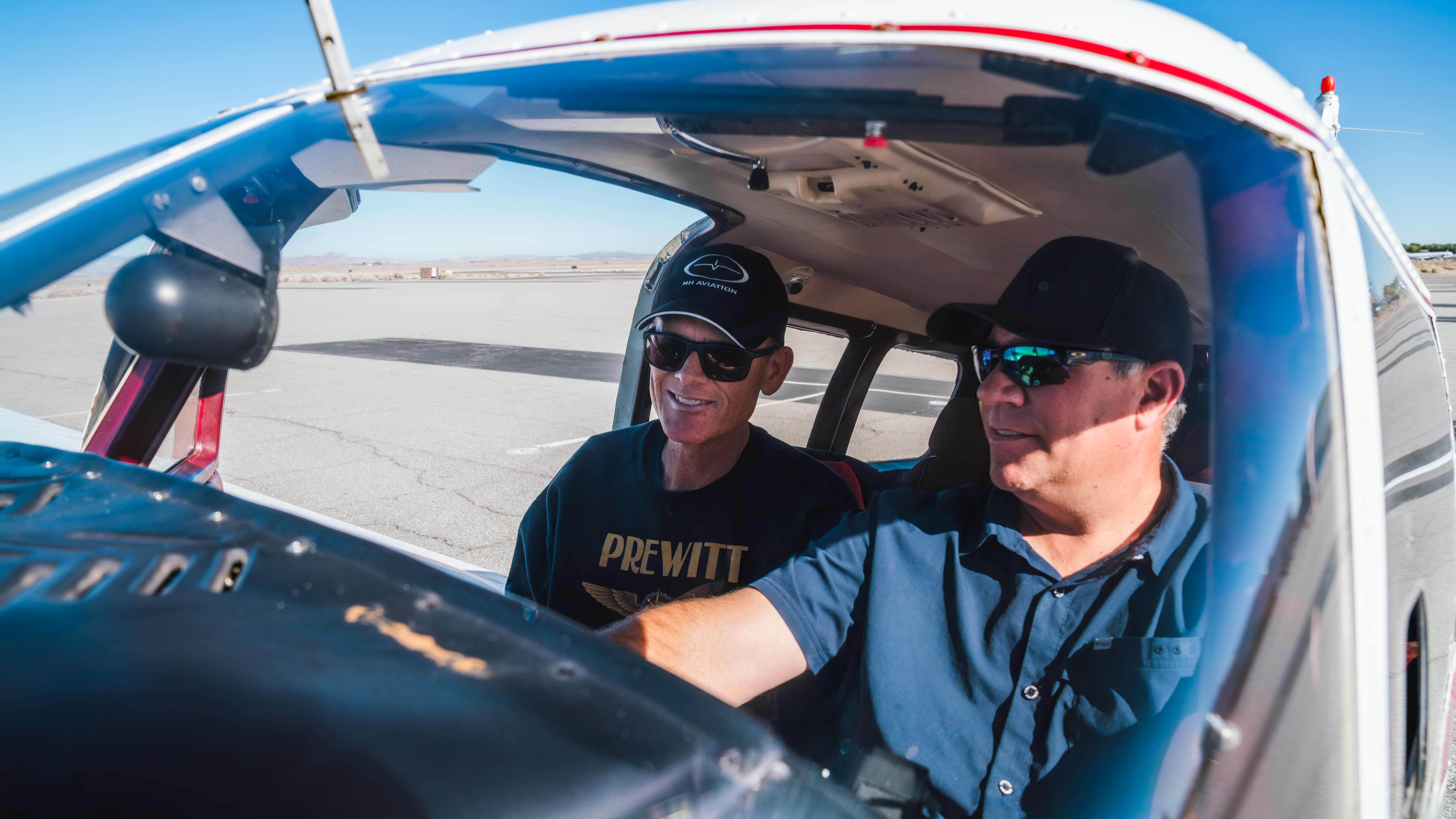 Certified Flight Instructor drawing on white board for private pilot student at Lancaster, CA