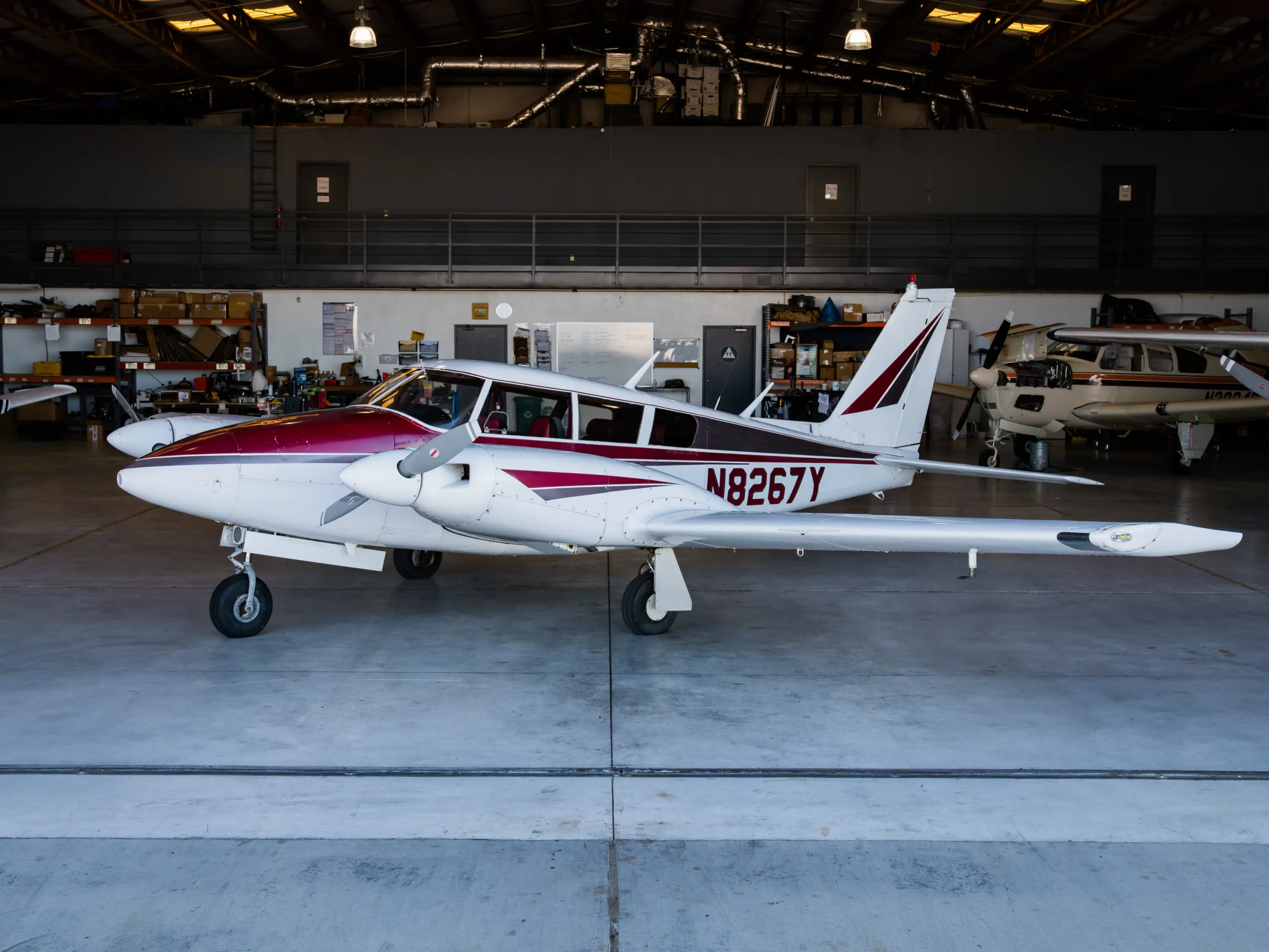 Pilot standing with aircraft on the ramp at MH Aviation