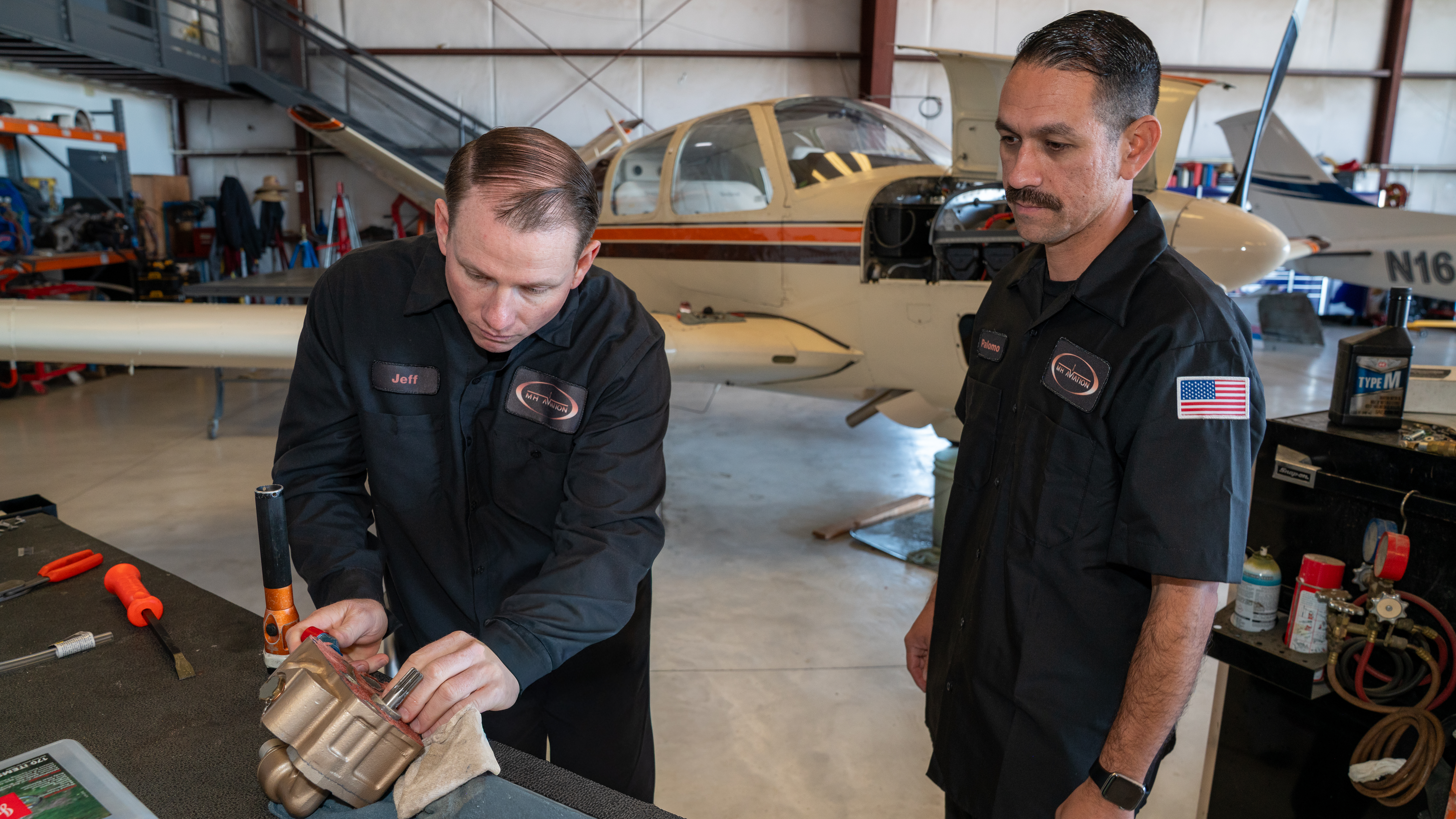 Aircraft maintenance work table and parts at MH Aviation in California